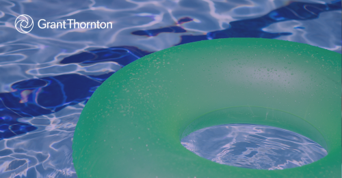 Green innertube floating in a pool