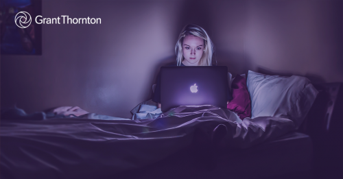 Woman in bed on a laptop